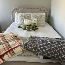 Tan Upholstered Queen Bed