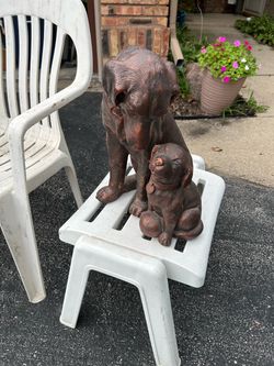 Decorative bronze-finished resin statue of a dog and puppy