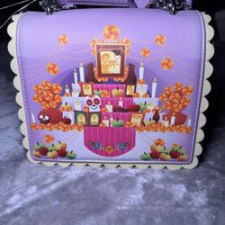 Coco Loungefly handheld/crossbody bag + Matching handheld Wallet.