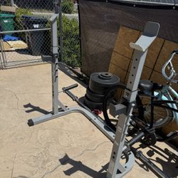 Squat Rack, barbell, 275 Lbs of Rubber Plates 