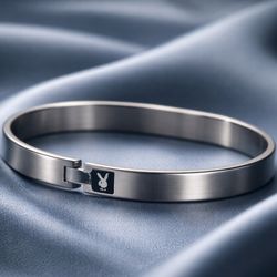 Playboy-branded metal bangle bracelet