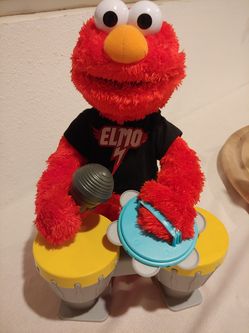 Elmo plays drums