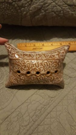 Pottery pillow to hold fresh cut flowers