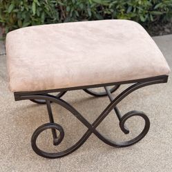 upholstered bench with a wrought iron base 19x25x17