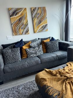 Gray two piece couch with Ottoman