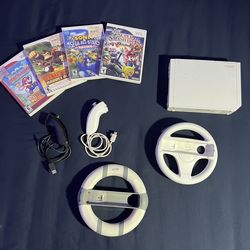 Nintendo Wii Bundle- 4 games, 2wheels, nunchucks, & all cables