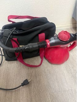 Scünci Steamer (Model SS1000) is a portable, 1000-watt handheld steam cleaner