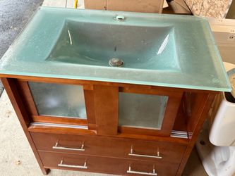 Bath cabinet with glass