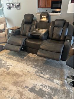 Grey leather couch with reclining seats