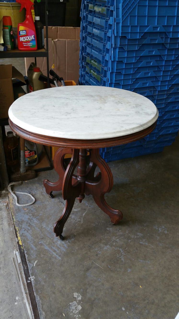 Antique wooden and marble top table over a hundred years old and it looked damn good