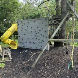 Free ! A big yellow Twist N' Ride tube slide, rugged rock-climbing wall, Zipline , and the swing set 