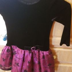 This is a very cute holiday dress dark maroon and black velvet