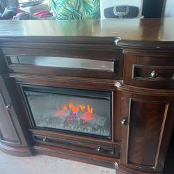 TV Stand. And Fire Place.  Working Good  79x44 