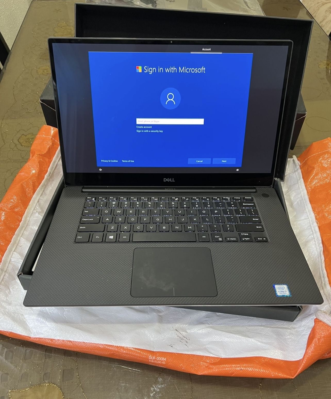 Dell XPS 7590 with 64GB RAM, Intel Core i7 processor, 1TB storage, and a 15.6-inch OLED display