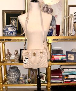 Bebe Aerin Blush Quilted Satchel bag in light pink (blush) with V-capped design and a distinctive gilded logo decorative padlock.