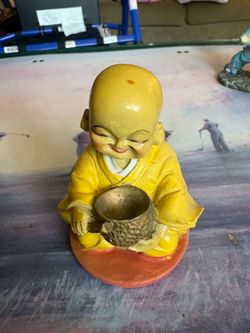 5 buddha figurines