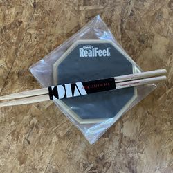Drum practice pad and sticks