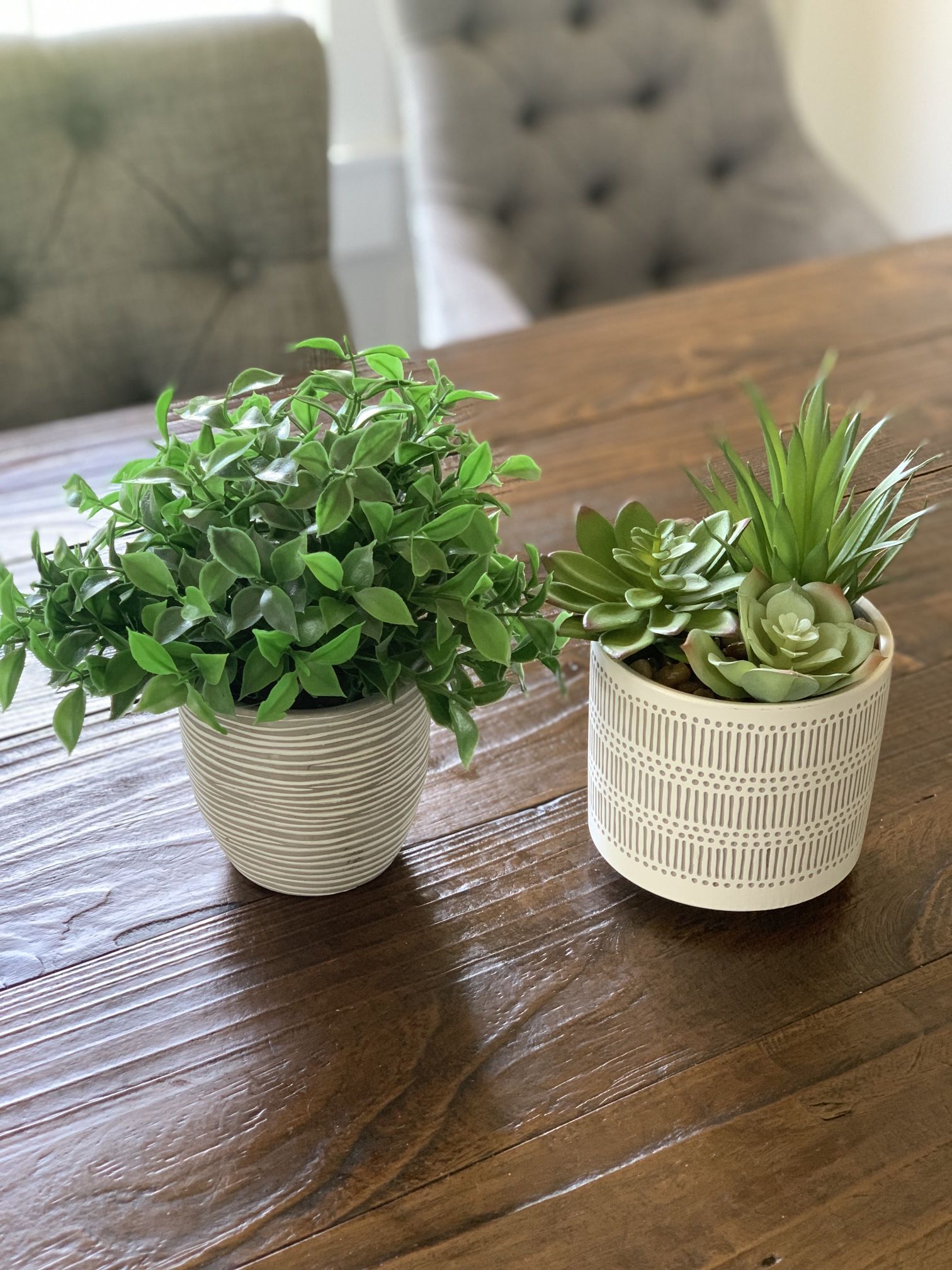 2 artificial plants in ceramic pots