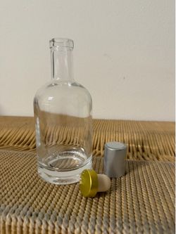 Glass bottle with cork and airtight cover