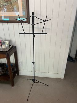 On Stage Stands Folding Music Stand with Carrying Bag Lightweight, adjustable black music stand.