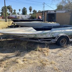Three boats with trailers