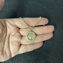 Gold plated Guadeloupe pendant with chain.