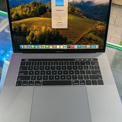 MacBook Pro 2018 15" Touch Bar Retina Intel 6 Core i7 16gb Ram 512GB SSD macOS Sonoma Charger 

There is a white spot on the screen and visible only o