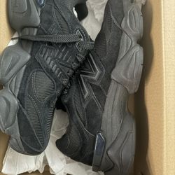 All black New Balances 