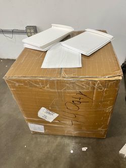 White Textur Bulk lot of white rectangular plastic trays with a textured/waffle surface. Multiple trays visible, stored in a large cardboard box. Box 