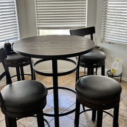 Table With Four Swivel Stools