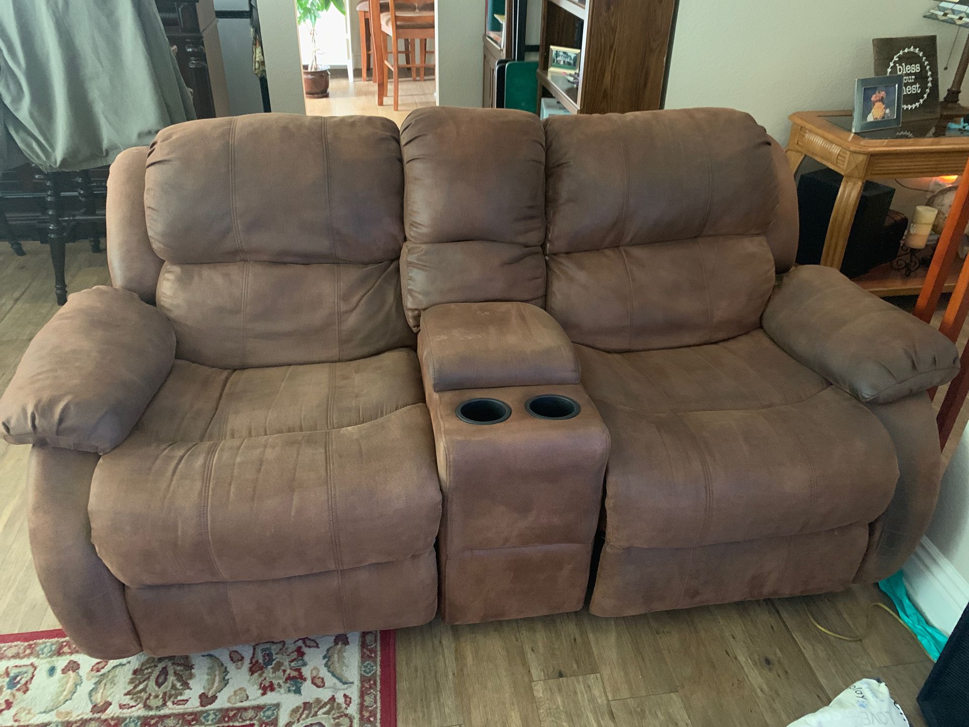 Double rocker recliner, center consul with two cupholders.