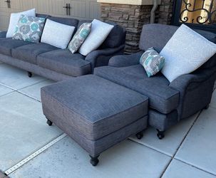 Gray three piece living room couch set