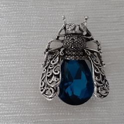 Insect Brooch with a blue gem & silver detailing.