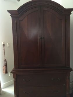  Wood Armoire with shelves and drawers .