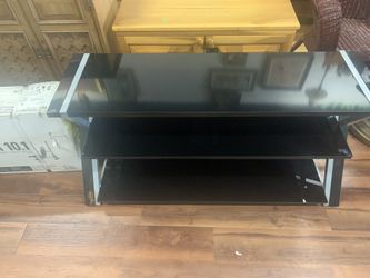 Black glass tv stand ( holds up to 60” tv)