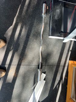 Bench and leg curl and preacher bar with weights