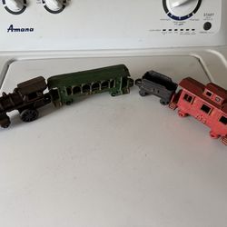 1960s cast iron train set four pieces as is