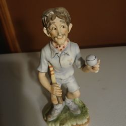 vintage ceramic pickleball player figurine, likely made in Japan. 
