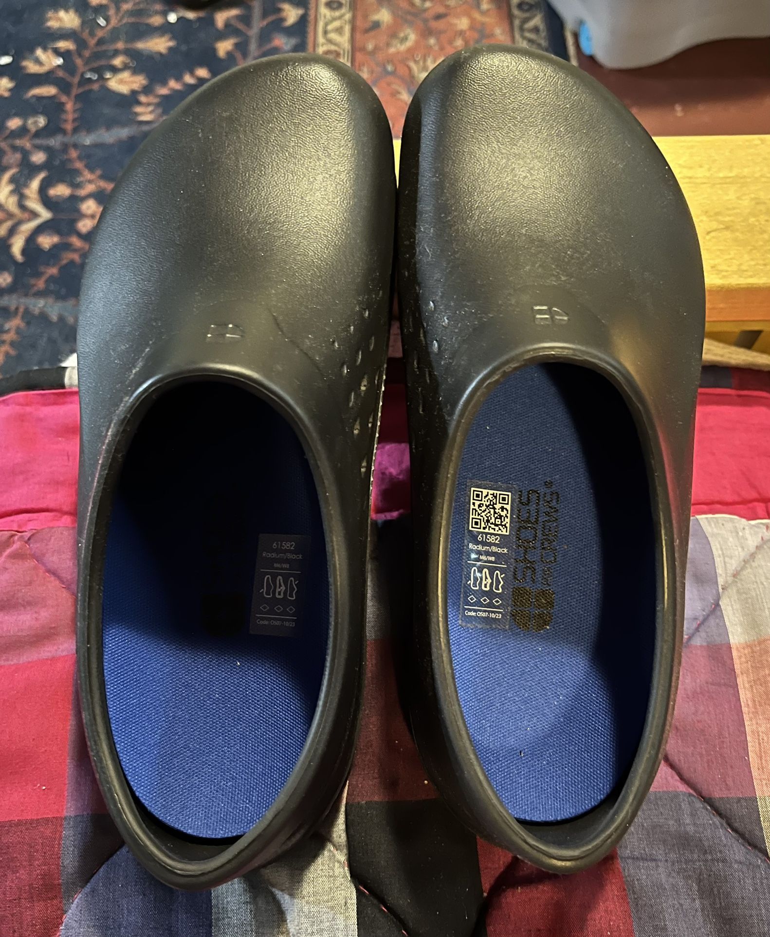 Woman’s Black Clogs