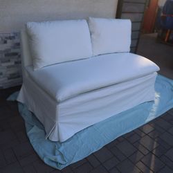 White Slipcovered Bench