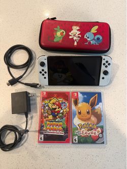 Nintendo Switch OLED with 2 games and travel case