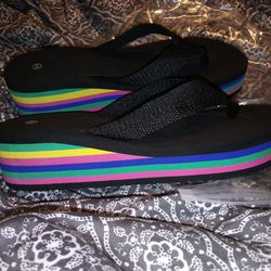 Brand New Black Flip Flops With Rainbow Wedge. Size 9 $8
