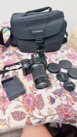 Canon EOS Mirrorless Camera with Lens and Bag
