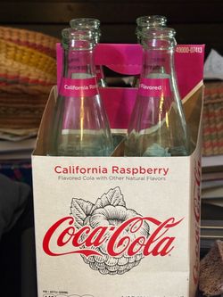 Coca Cola raspberry bottles (4)  and holder