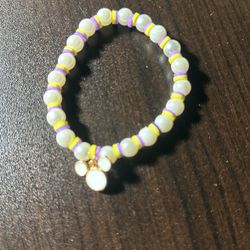 Pearl Beads And Purple And Yellow Clay Beads With A White Mickey Charm