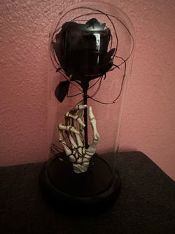 Black rose and skeletal hand
