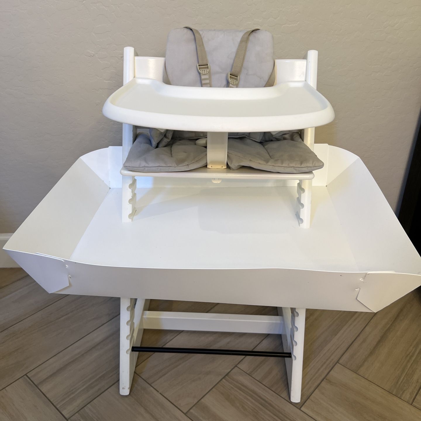 White Stokke Tripp Trapp High Chair with cushion and tray and silicone mat covers