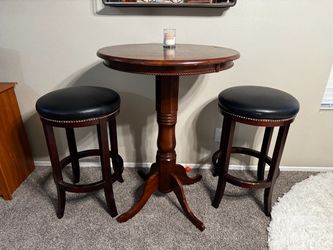 Round bar table with stools.