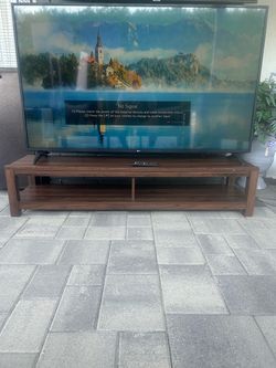 65 Inch LG Smart Tv With Modern Tv Stand. Good Condition W Remote