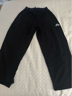 Nike black sweatpants with zipper detail, size L